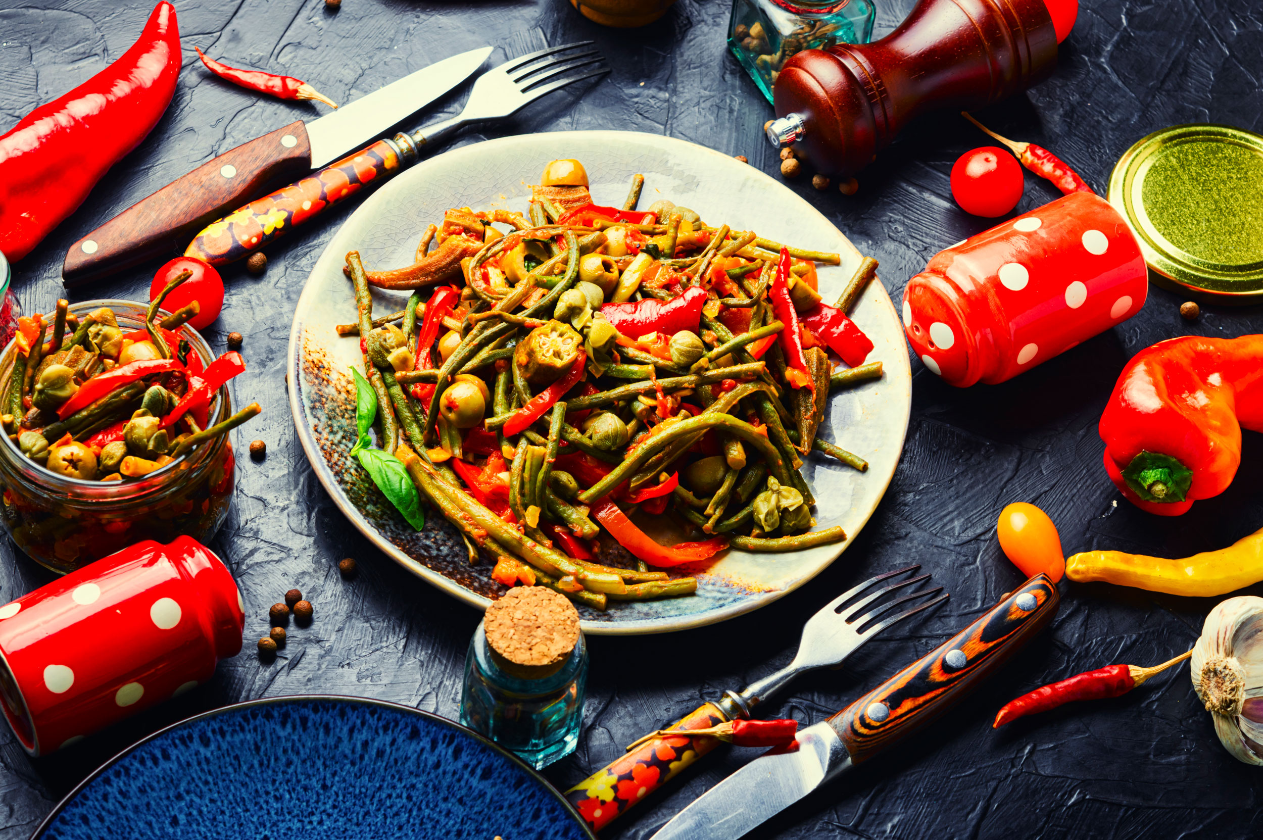 table with spicy food and red chili peppers